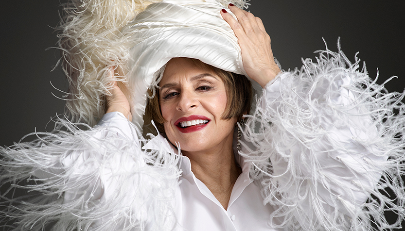 Patti Lupone In A White Feather Boa And Turban